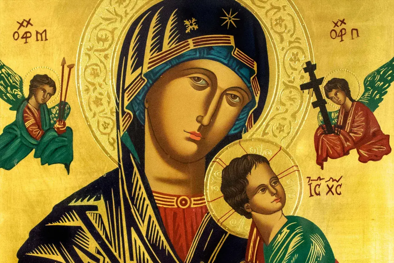 Ikona Matki Bożej z Dzieciątkiem, otoczona aniołami. W tle złoto, symbolizujące boskie światło. Paraklet, pocieszyciel, obecny w tej świętej scenie.